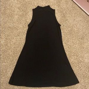Black sleeveless dress with slight turtle neck